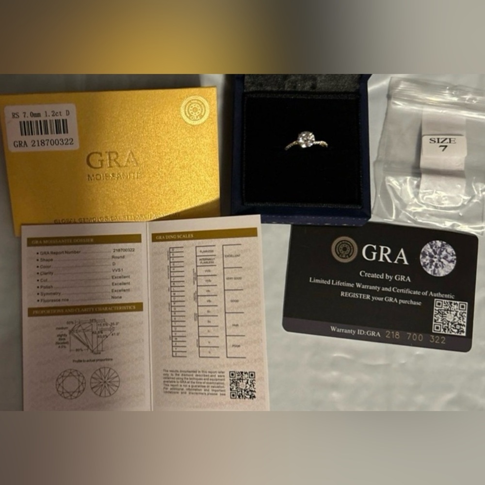 1.2 carat moissanite ring. With GRA 925 set in  plated  18K gold size 7 NWT